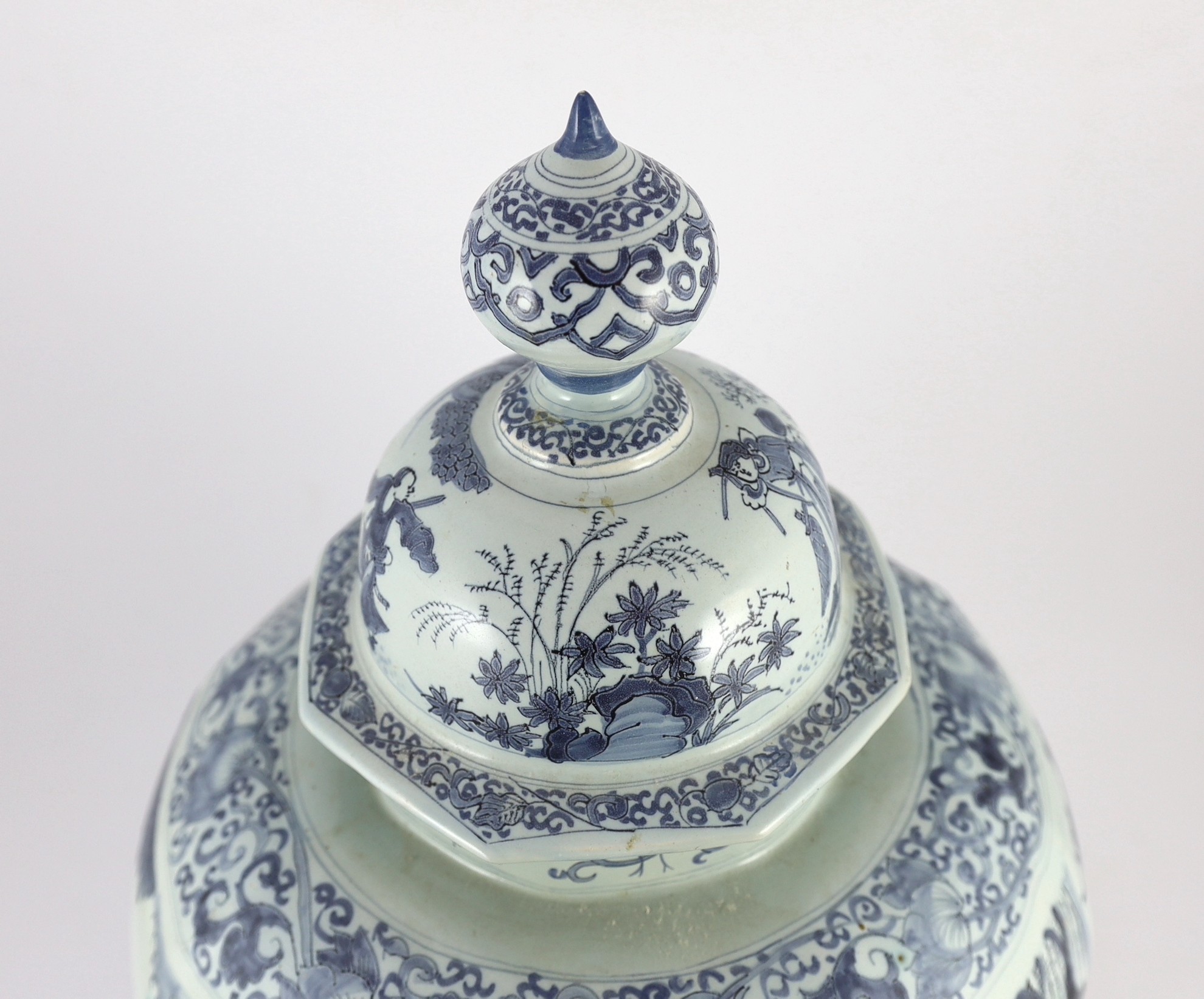 A massive Delft blue and white inverted baluster vase and cover, c.1700, 57.5cm high, neck and cover restored
